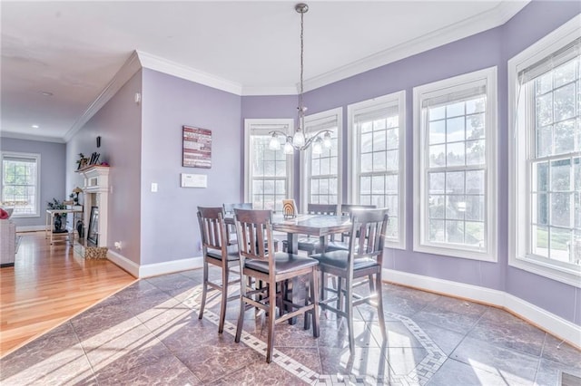 31 Meadow Lakes Ter, Cedartown, GA 30125 - dining area featuring baseboards, crown molding, a chandelier, and a fireplace