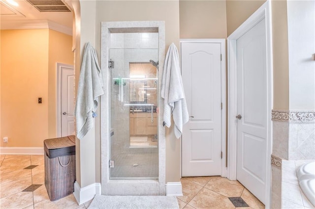 31 Meadow Lakes Ter, Cedartown, GA 30125 - bathroom with a shower stall, a garden tub, tile patterned flooring, baseboards, and ornamental molding