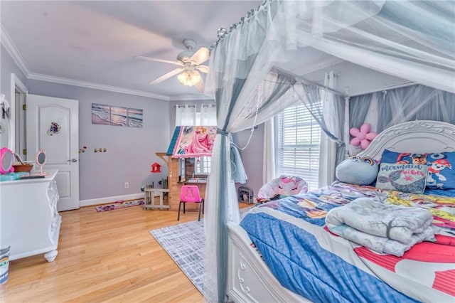 bedroom featuring crown molding, ceiling fan, and light hardwood / wood-style floors