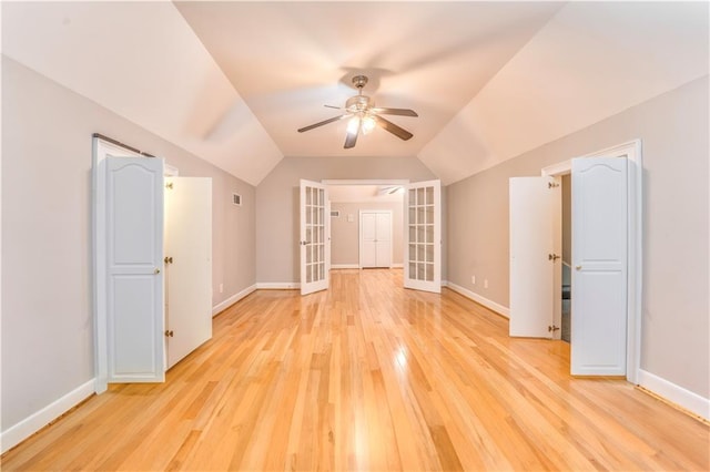 bonus room featuring french doors, vaulted ceiling, light hardwood / wood-style floors, and ceiling fan