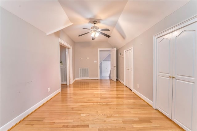 interior space featuring lofted ceiling, light hardwood / wood-style flooring, and ceiling fan