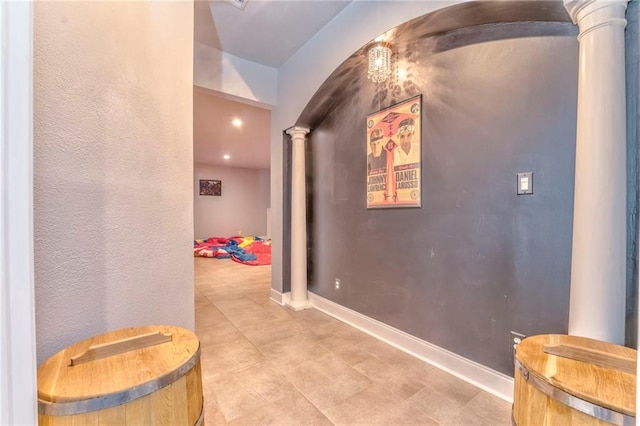 31 Meadow Lakes Ter, Cedartown, GA 30125 - corridor with ornate columns, light tile patterned flooring, baseboards, and arched walkways