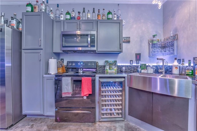 kitchen featuring gray cabinets, appliances with stainless steel finishes, and wine cooler