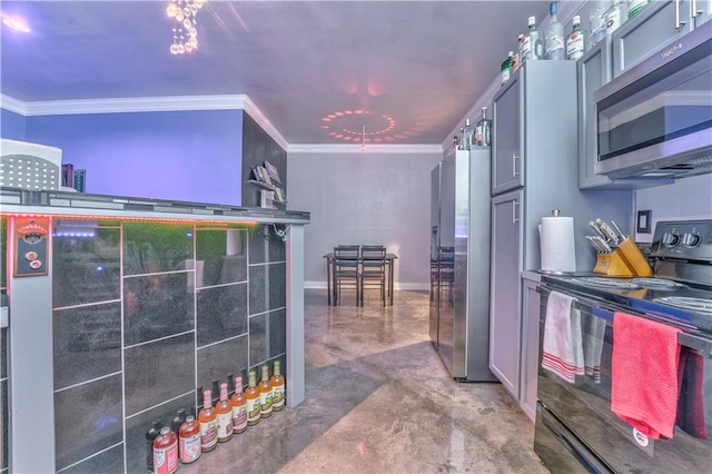 kitchen featuring stainless steel appliances, ornamental molding, gray cabinetry, and concrete flooring