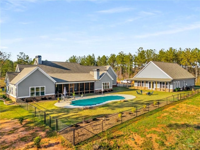 view of swimming pool with a fenced backyard, a fenced in pool, a patio, and a yard