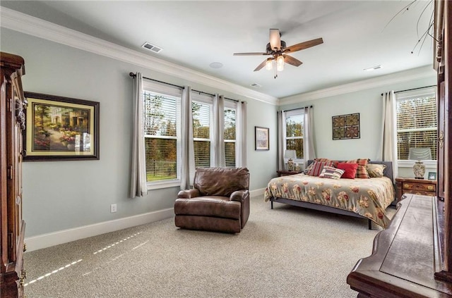 bedroom featuring multiple windows, ceiling fan, crown molding, and carpet floors