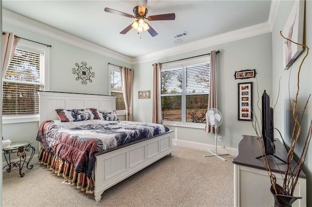 bedroom with ceiling fan, light carpet, and ornamental molding