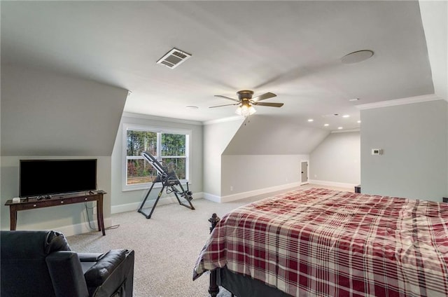 carpeted bedroom with vaulted ceiling, ceiling fan, and ornamental molding