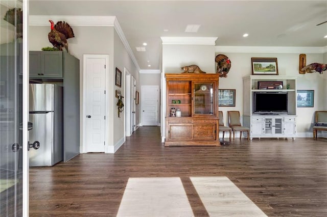 unfurnished living room with ornamental molding and dark wood-type flooring