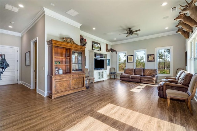 living room featuring hardwood / wood-style flooring, ceiling fan, and ornamental molding