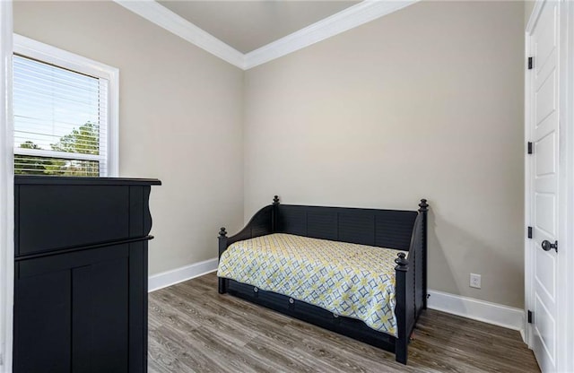 bedroom featuring crown molding and hardwood / wood-style floors