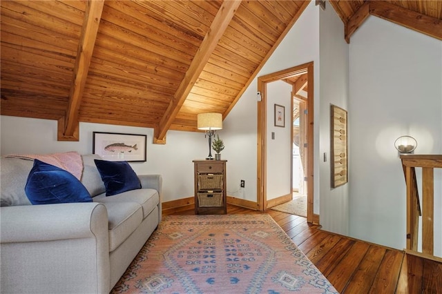 living area with light wood-type flooring, lofted ceiling with beams, and wood ceiling