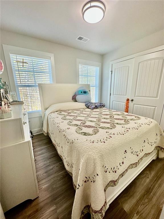 bedroom featuring dark hardwood / wood-style flooring