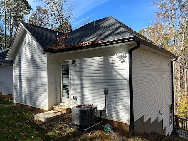 view of side of home with cooling unit