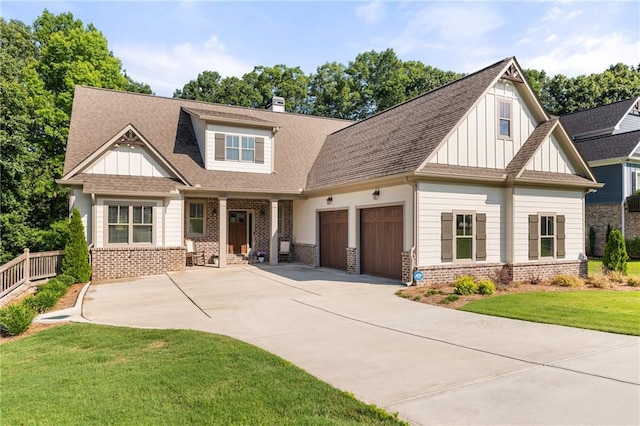 5821 Abbey View Ct, Clermont, GA 30527 - craftsman-style house with board and batten siding, an attached garage, brick siding, and concrete driveway