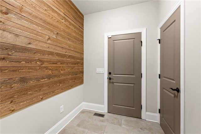 5821 Abbey View Ct, Clermont, GA 30527 - doorway to outside with baseboards and wood walls