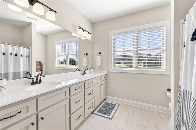 5821 Abbey View Ct, Clermont, GA 30527 - bathroom with double vanity, marble look tiles, a chandelier, and curtained shower