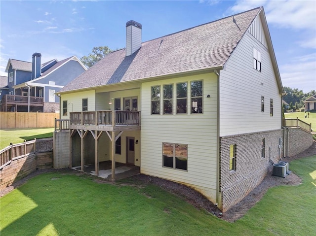 5821 Abbey View Ct, Clermont, GA 30527 - rear view of property featuring a chimney, a deck, a patio, a fenced backyard, and brick siding