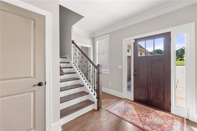 5821 Abbey View Ct, Clermont, GA 30527 - foyer entrance with crown molding, stairway, and wood finished floors