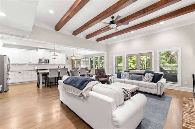 5821 Abbey View Ct, Clermont, GA 30527 - living area featuring ceiling fan, beamed ceiling, recessed lighting, ornamental molding, and light wood-type flooring
