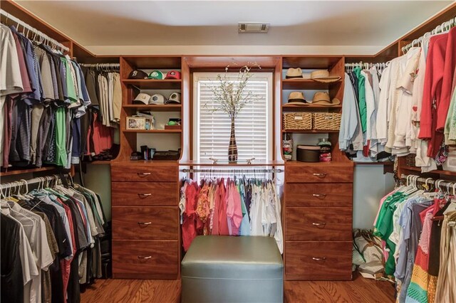 spacious closet with wood finished floors and visible vents