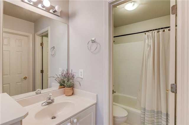 bathroom featuring shower / bath combination with curtain, toilet, and vanity