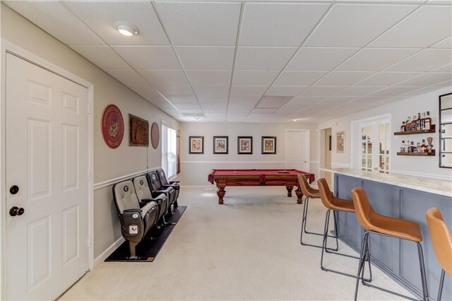 playroom with billiards, a dry bar, carpet flooring, and a paneled ceiling