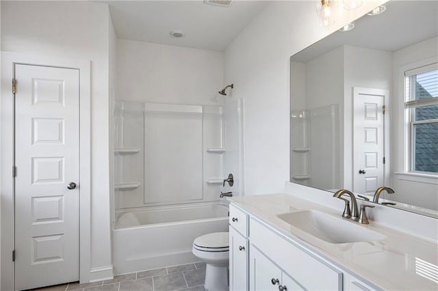 bathroom featuring tub / shower combination, vanity, toilet, and tile patterned floors