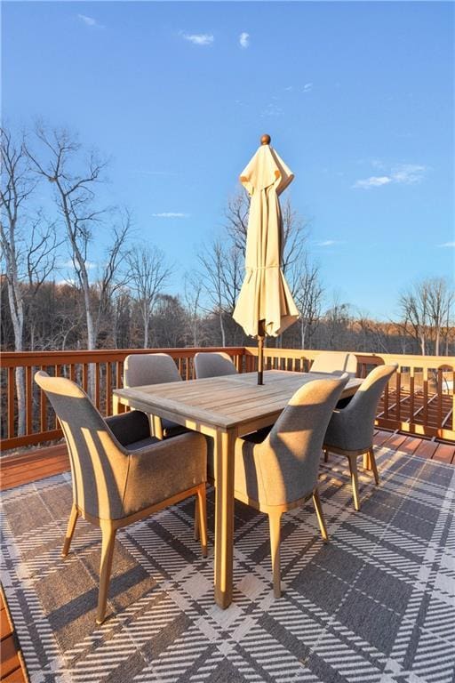 deck with outdoor dining area