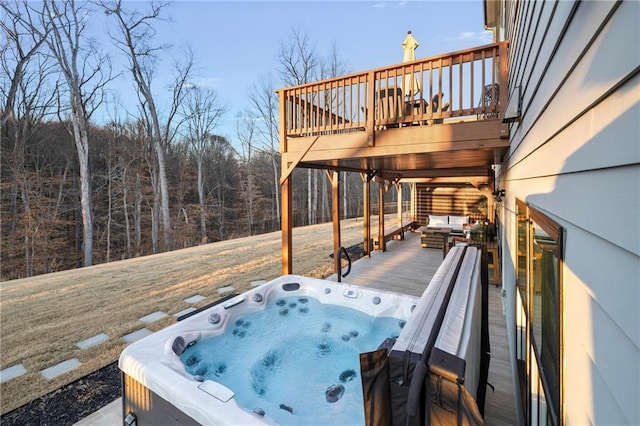 wooden terrace featuring a hot tub