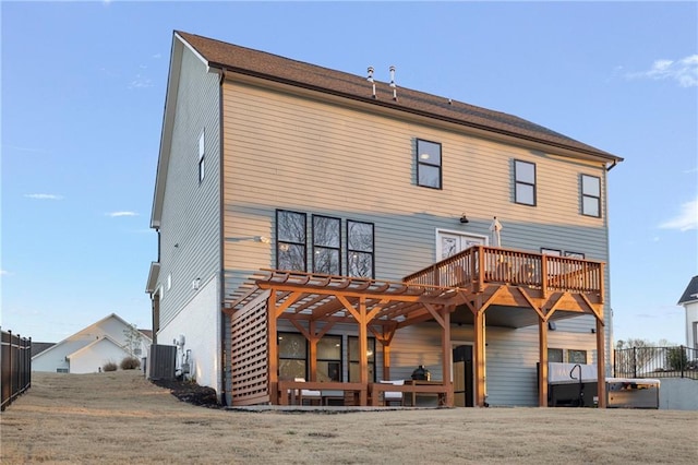 rear view of house with fence and cooling unit