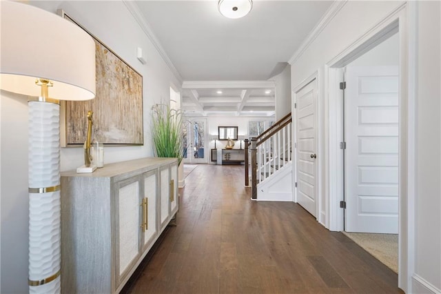 entryway featuring coffered ceiling, stairway, ornamental molding, dark wood-style flooring, and beam ceiling