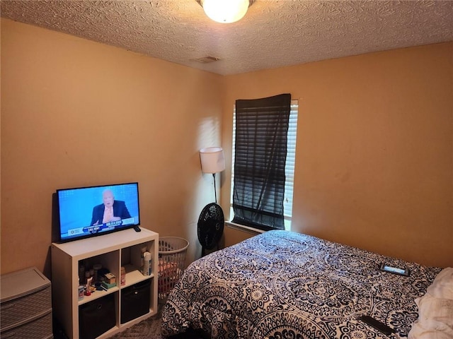 bedroom featuring a textured ceiling