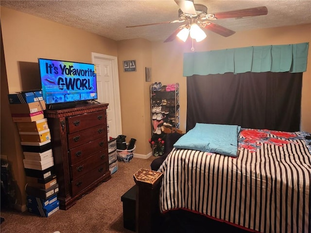 carpeted bedroom with a textured ceiling and ceiling fan