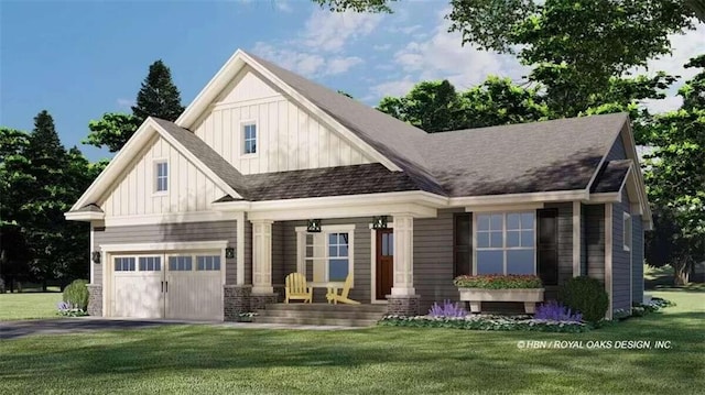 view of front of house with a front yard and a garage