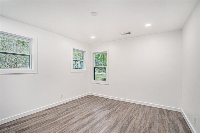 spare room featuring hardwood / wood-style flooring