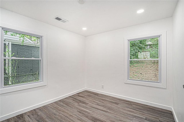 empty room featuring dark hardwood / wood-style floors