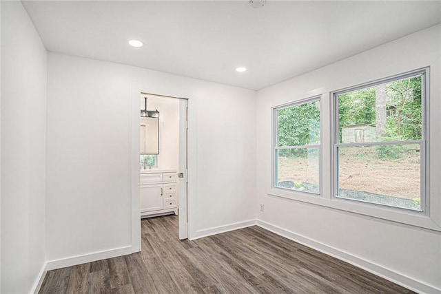 unfurnished room with dark hardwood / wood-style floors