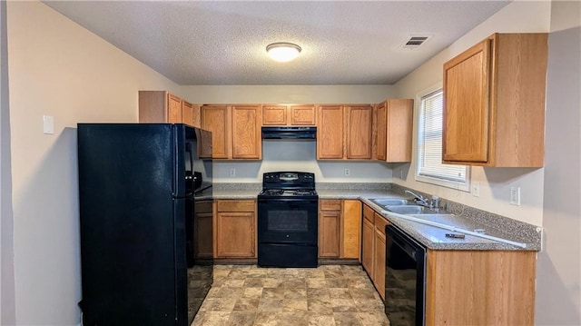 kitchen featuring a textured ceiling, sink, extractor fan, and black appliances