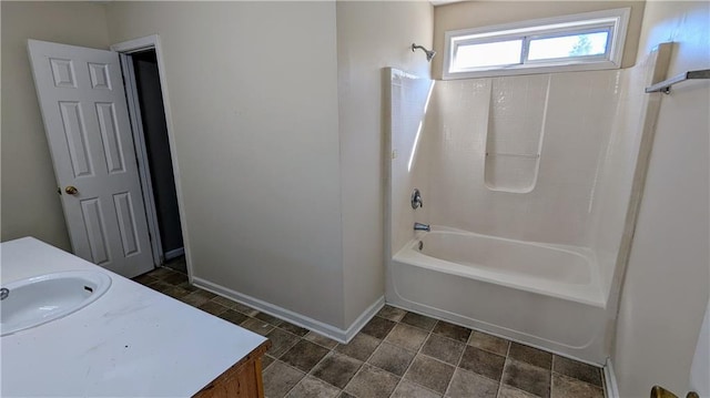 bathroom featuring vanity and  shower combination