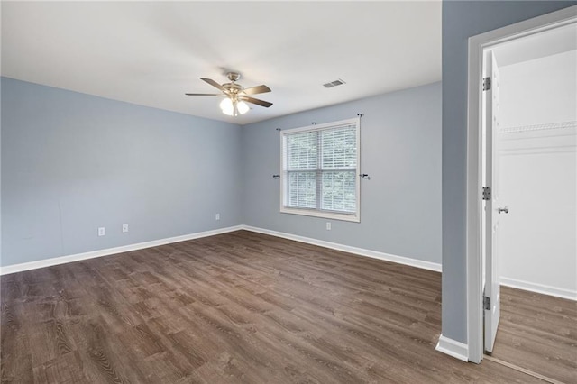 3737 Town Square Cir NW Unit 6, Kennesaw, GA 30144 - empty room featuring a ceiling fan and dark wood-type flooring
