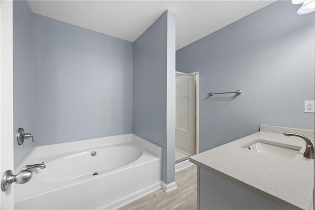 3737 Town Square Cir NW Unit 6, Kennesaw, GA 30144 - full bathroom with a garden tub, a shower stall, vanity, and wood finished floors
