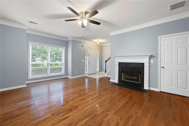 3737 Town Square Cir NW Unit 6, Kennesaw, GA 30144 - unfurnished living room featuring a ceiling fan, wood finished floors, crown molding, and stairs
