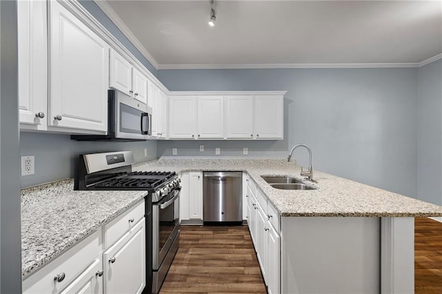 3737 Town Square Cir NW Unit 6, Kennesaw, GA 30144 - kitchen with stainless steel appliances, a peninsula, dark wood finished floors, white cabinets, and ornamental molding