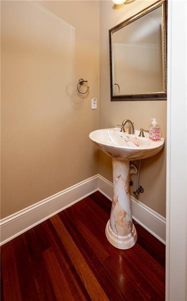 bathroom with hardwood / wood-style flooring