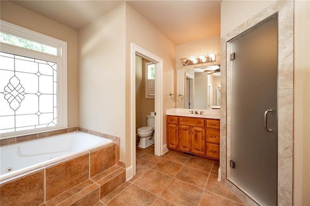 full bathroom featuring vanity, toilet, independent shower and bath, and tile patterned flooring