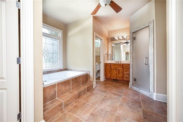 bathroom with ceiling fan, tile patterned floors, vanity, and separate shower and tub