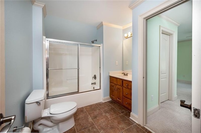 full bathroom featuring combined bath / shower with glass door, vanity, toilet, crown molding, and tile patterned floors