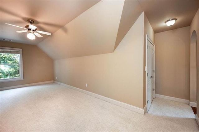 bonus room featuring vaulted ceiling, light colored carpet, and ceiling fan