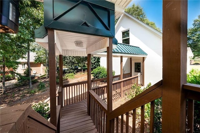 wooden terrace with a porch